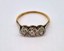 An 18ct three stone diamond ring, size T, approx 2.8g.