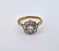 A diamond 'Daisy' style cluster ring, set in yellow gold (not hallmarked), size J.