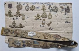 A collection of WWI/WWII cap badges, together with a belt, to include badges of the corps of the