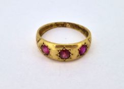 An 18ct gold ring set with pink stones, approx 3.1g.