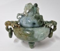 A green stone elaborately carved bowl and cover, on three legs, foliate carving, height approx 13cm.