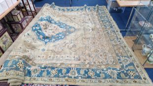 A patterned rug, approx 300cm x 380cm.