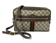 Gucci, an Ophidia GG cam shoulder bag, Gucci tag number G024451151, with two small booklets,