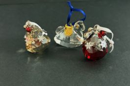 Swarovski Crystal Glass, three Christmas hanging Ornaments including Bell, Ball and Rocking Horse,