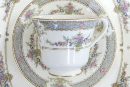 A collection of Minton Persian Rose tea and dinnerware, including tea set, large platters,