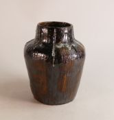 A 20th century studio pottery vase of squat form. Decorated in lustre glaze with white highlighting.