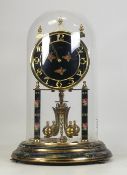 A Kundo Anniversary Glass Domed Clock, floral decoration to face and base. Height: 30cm