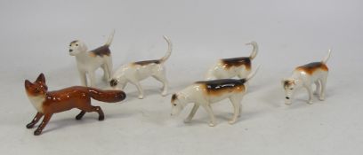 Beswick, Five Models of Hunting Dogs together with a Fox. (6)