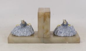 Royal Doulton, A Pair of Early Polly Peachum HN698 lady figures on onyx bases. a/f one arm and one