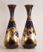 A pair of Carlton Blush ware large footed vases with blue & white Florida floral decoration, by