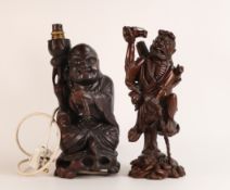 Two Oriental hardwood figures, including Monk lamp and an Immortal figure atop a turtle. Height of