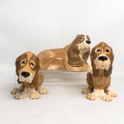 Three SZeiler studio dogs to include large laying down dog and two Bloodhound dogs. (H: 15cm) (3)