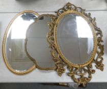 A group of Gilt decorated mirrors in various designs, measurements of largest 90cm x 56cm. (3)