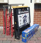 A collection of adjustable trestles and fold up work bench. (5)