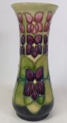 Moorcroft, Violet design vase of waisted form. Height: 21cm