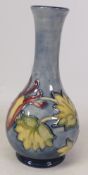 Moorcroft, Columbine pattern on blue ground vase of bottle form. Height: 15.5cm
