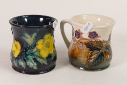 Moorcroft, Two mugs in the Bramble and Buttercup designs. (2)