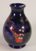 Moorcroft, Dragon design vase of baluster form. Height: 19cm