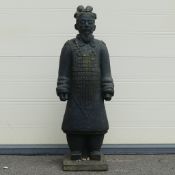 Reconstituted stone composite garden ornament of a standing Chinese warrior. (H: 96cm) COURIER OR