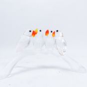 Swarovski Crystal Figurine featuring four baby lovebirds perched on a frosted branch