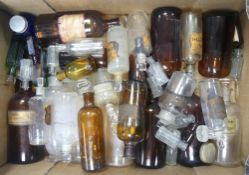 A collection of labelled apothecary and medicine bottles, many with glass stoppers. (1 Tray)