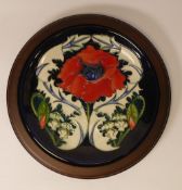 Moorcroft Plate 783/10, Poppy designer Rachel Bishop on dark blue ground measures 30cm including