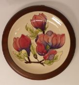 Moorcroft Plate 783/10, 'Magnolia' design on cream ground measures 30cm including surround with