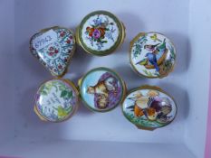 Six Halcyon Days enamelled pill boxes featuring designs of 'I Love You', Cats, Birds, 'For you