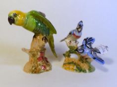 Beswick figure of a Parrot, together with Beswick figure American Blue Jays, height of tallest
