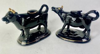 Two Staffordshire Pottery Cow Creamers both with original lids 11.5cm high (2)
