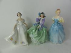 Three Royal Doulton lady figurines, Top o' the Hill HN1833, Enchantment HN2178 and Kate HN2789 (3).