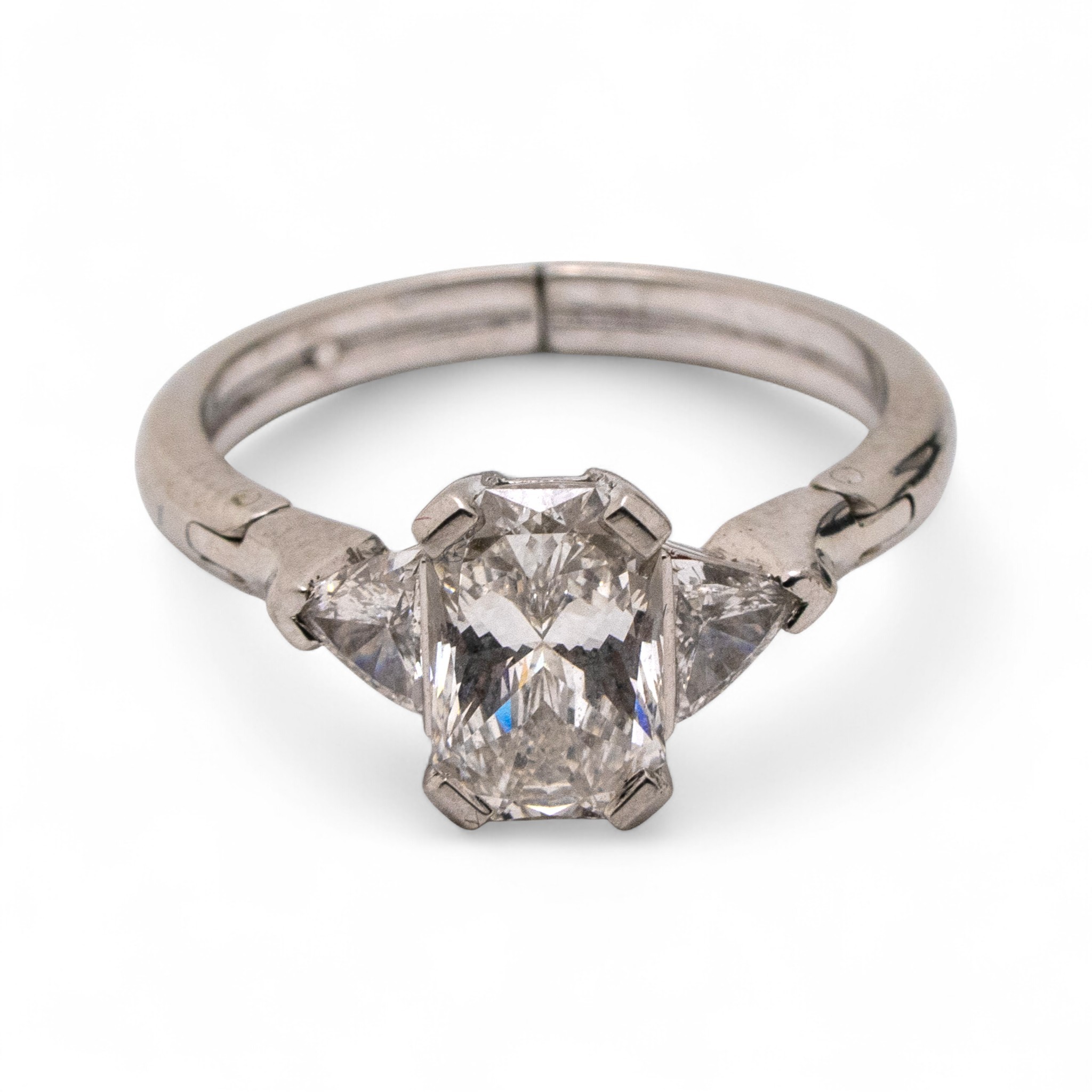 18ct Gold emerald cut diamond ring, ring size O expanding to S by means of hinged shoulders. Main