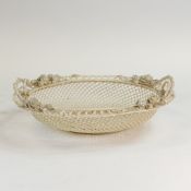 A large Belleek second period floral decorated oval basket, embossed floral decoration, length