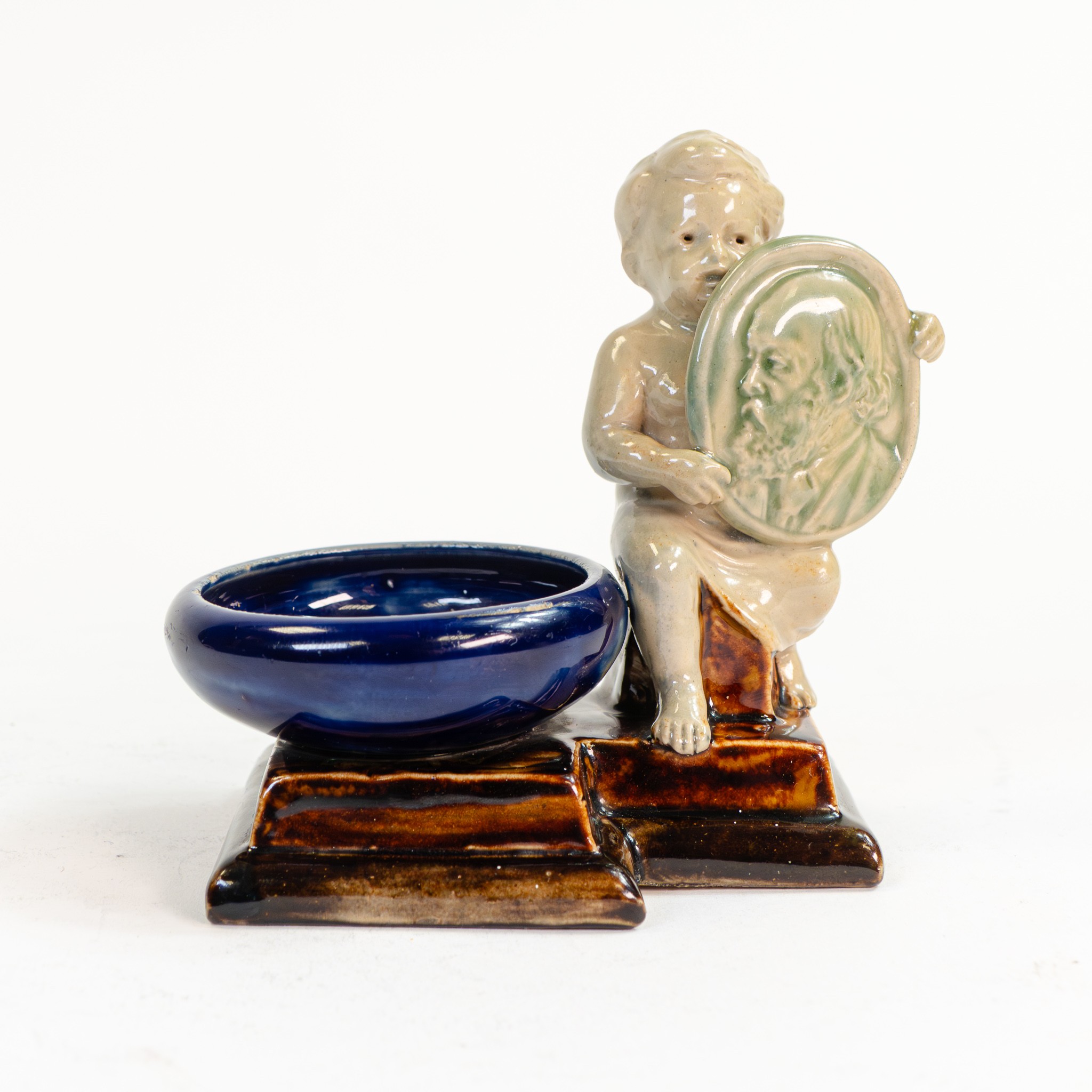 An exceptional and rare Doulton Stoneware figural salt by George Tinworth, a memory piece,