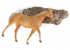 Royal Doulton Palomino horse on textured base depicting uneven terrain (loose from base). (H: 29cm)