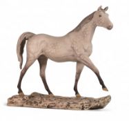 Beswick Dapple Grey horse on textured base depicting uneven terrain, boxed. (H: 30cm)