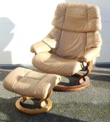 Ekornes Stressless swivel chair and footstool, in good condition, tan (2).