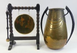 An Antique Brass Dinner Gong on a dark oak barley twist stand with Mallet together with a brass