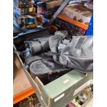 A tray of binoculars, mostly with cases