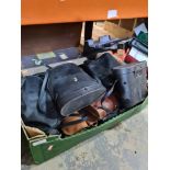 A tray of binoculars, mostly cased