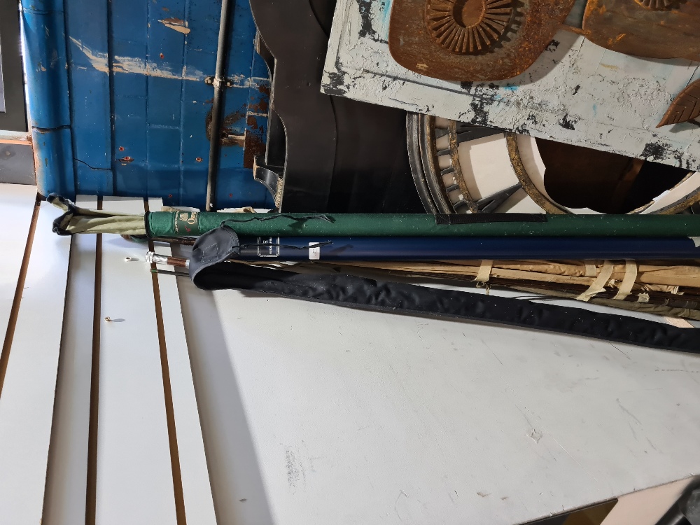 An Orvis silver label mid flex 6.0 fishing rod with fabric case, a House of Hardy 8ft two piece rod,