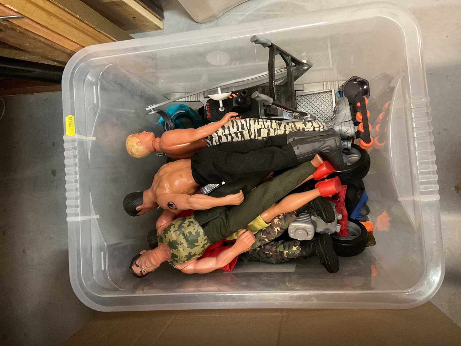 One box containing a selection of Action Man dolls and accessories.