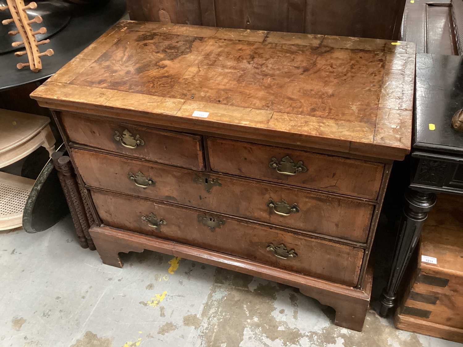 18th century and later walnut chest of drawers with two short and two long drawers with feather band