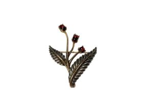 Tiffany & Co silver and 18ct gold foliate brooch set with three garnet cabochons, stamped 750, 925,