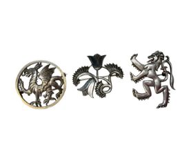 Two George Tarratt silver brooches designed by Geoffrey Guy Bellamy to include a dragon, no. 222 and