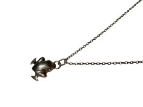 Georg Jensen Danish silver frog pendant no. 31, on a long white metal chain