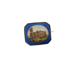 19th century Italian micro-mosaic brooch depicting The Colosseum, Rome, on a blue ground in a yellow