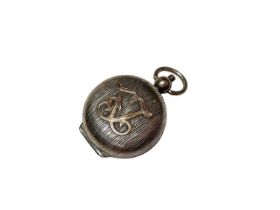 Silver sovereign holder with applied gold monogram and gilt interior