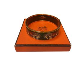 Hermès green enamel bangle with horse decoration, in box