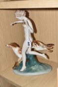 A PORCELAIN FIGURE OF A NUDE FEMALE WITH A BORZOI DOG on a mount, a gilded ball in hand, height 36cm